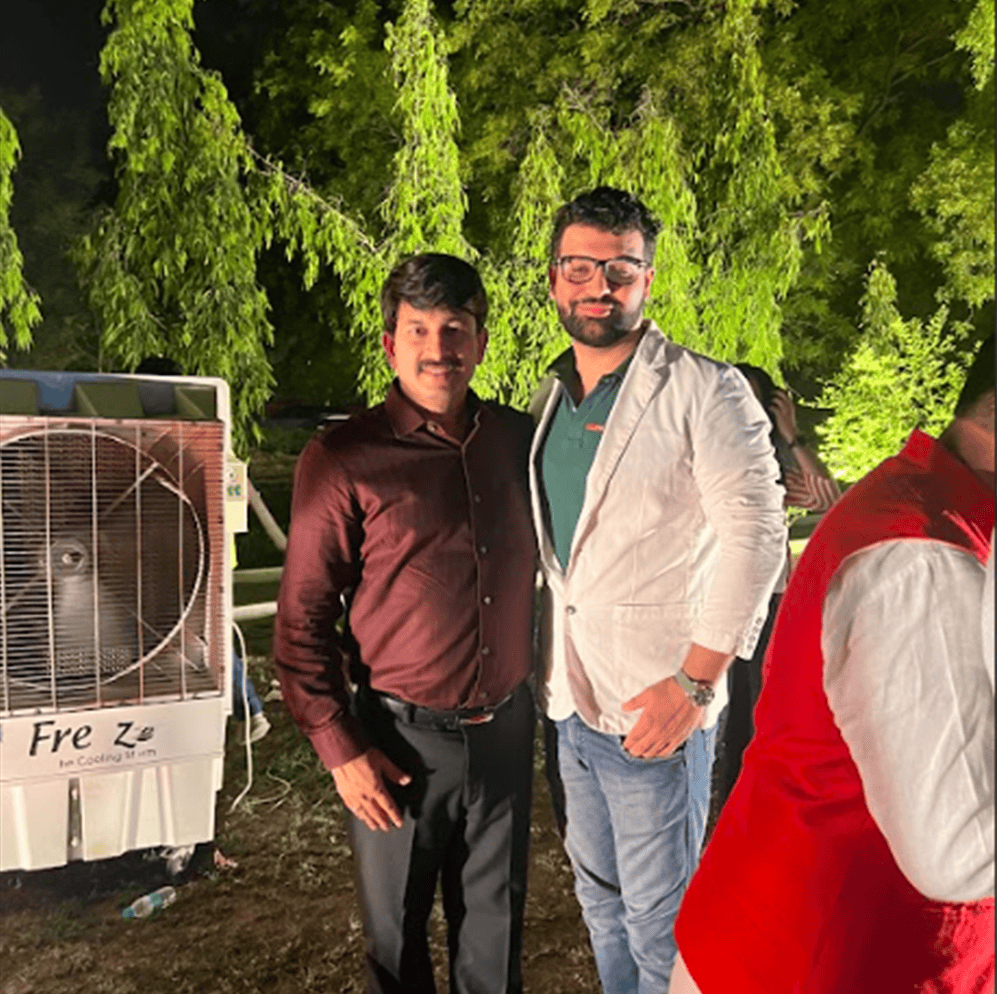 Psychic Medium Daksh with clients at outdoor spiritual event, providing guidance and insight.