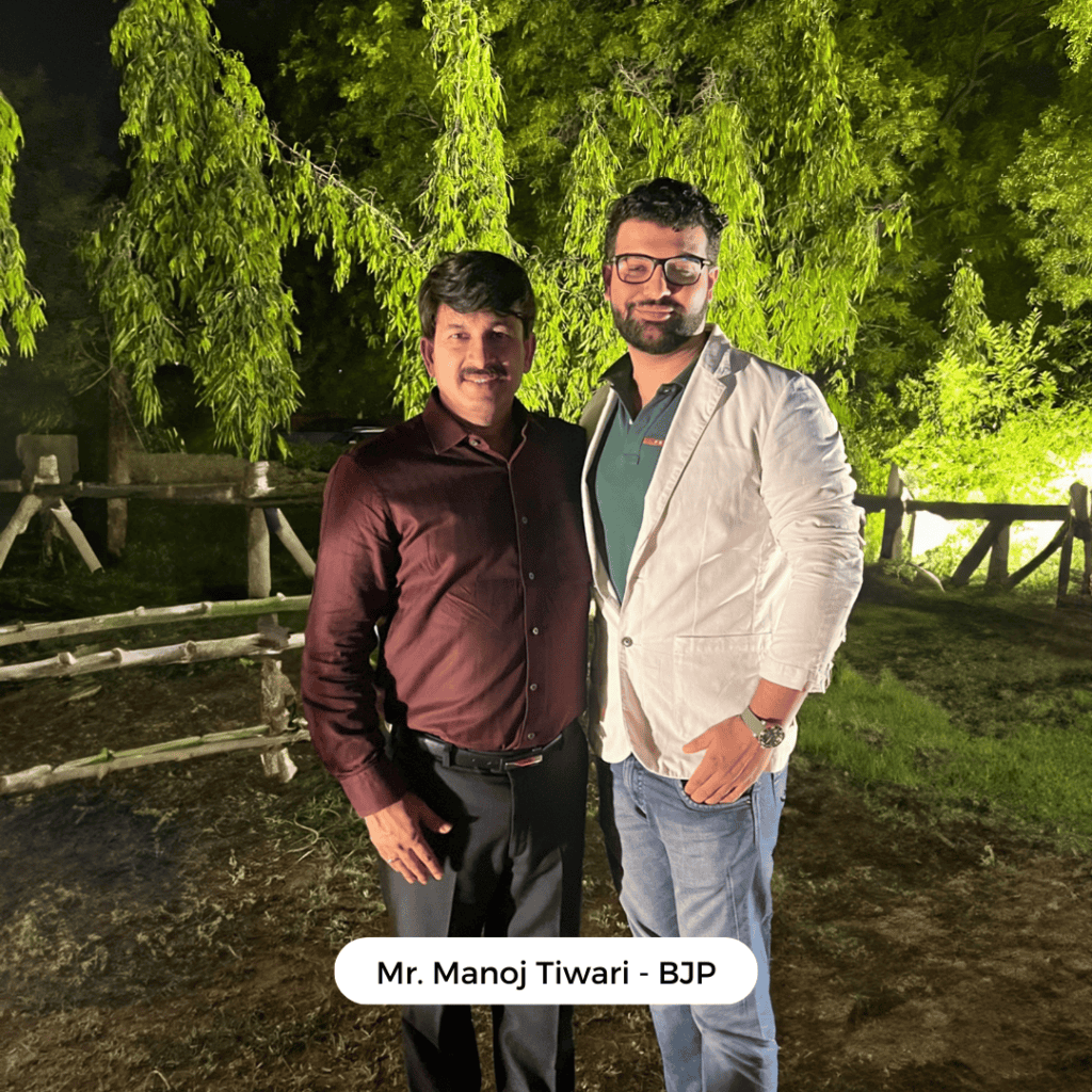 Psychic Medium Daksh with Manoj Tiwari, BJP leader, outdoors at night.