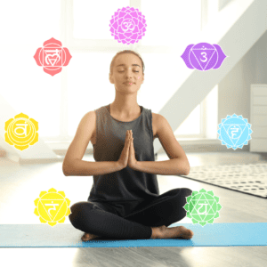 Woman meditating with chakra symbols for spiritual healing and energy balance.