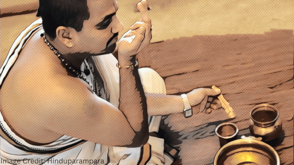 Man performing Achamanam ritual for spiritual cleansing and mental purification.