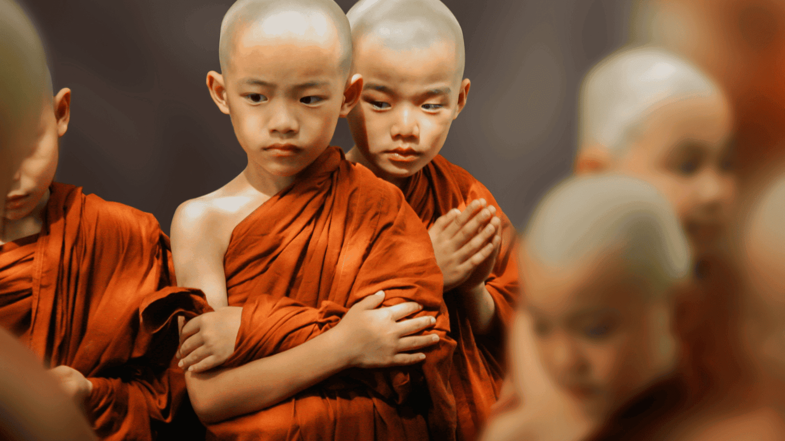 Young monks meditating, emphasizing spiritual importance of gurus in life.