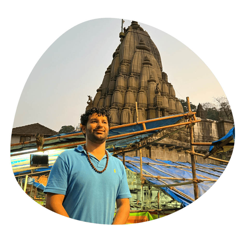 Psychic Medium Daksh near ancient temple for spiritual guidance.